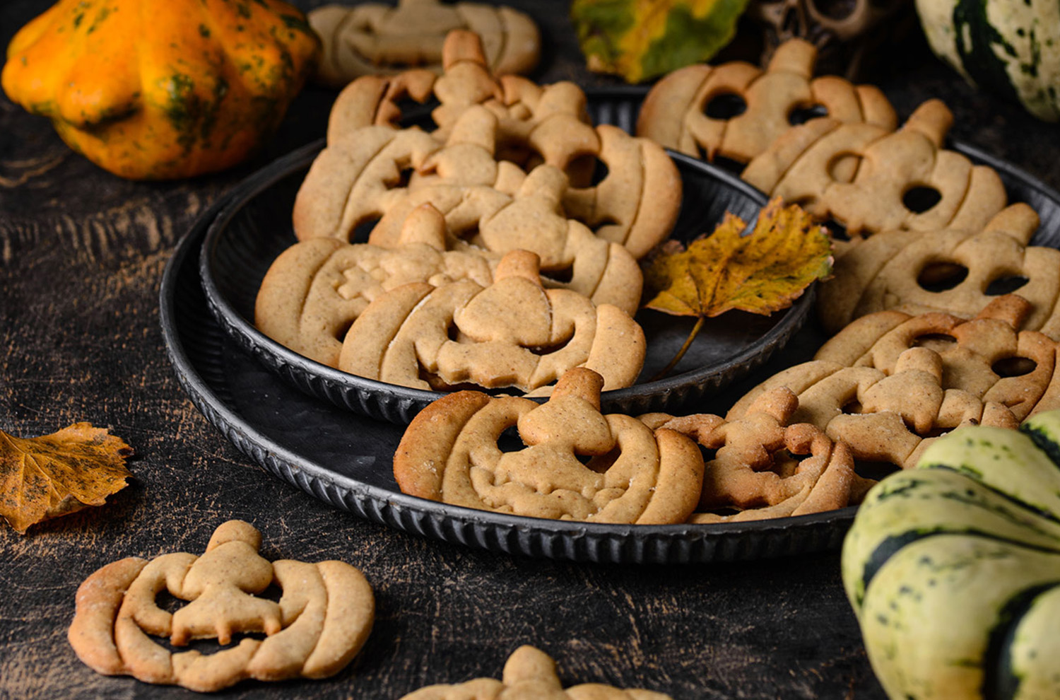 plate of pumpkin shaped gingerbread cookies